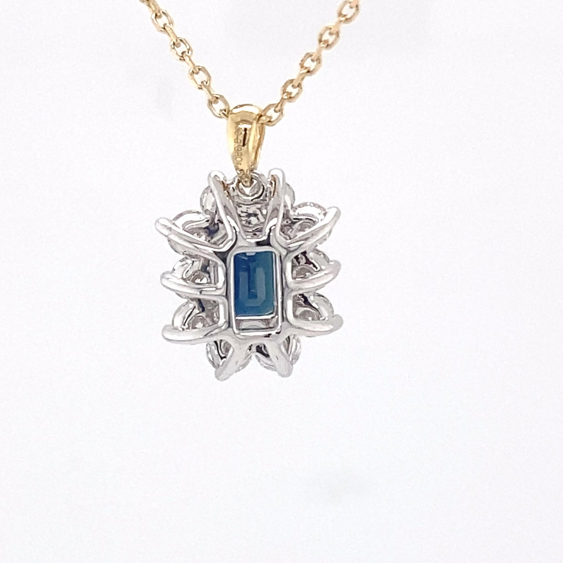 Octagonal sapphire and round brilliant cut diamond cluster pendant  Gardiner Brothers   