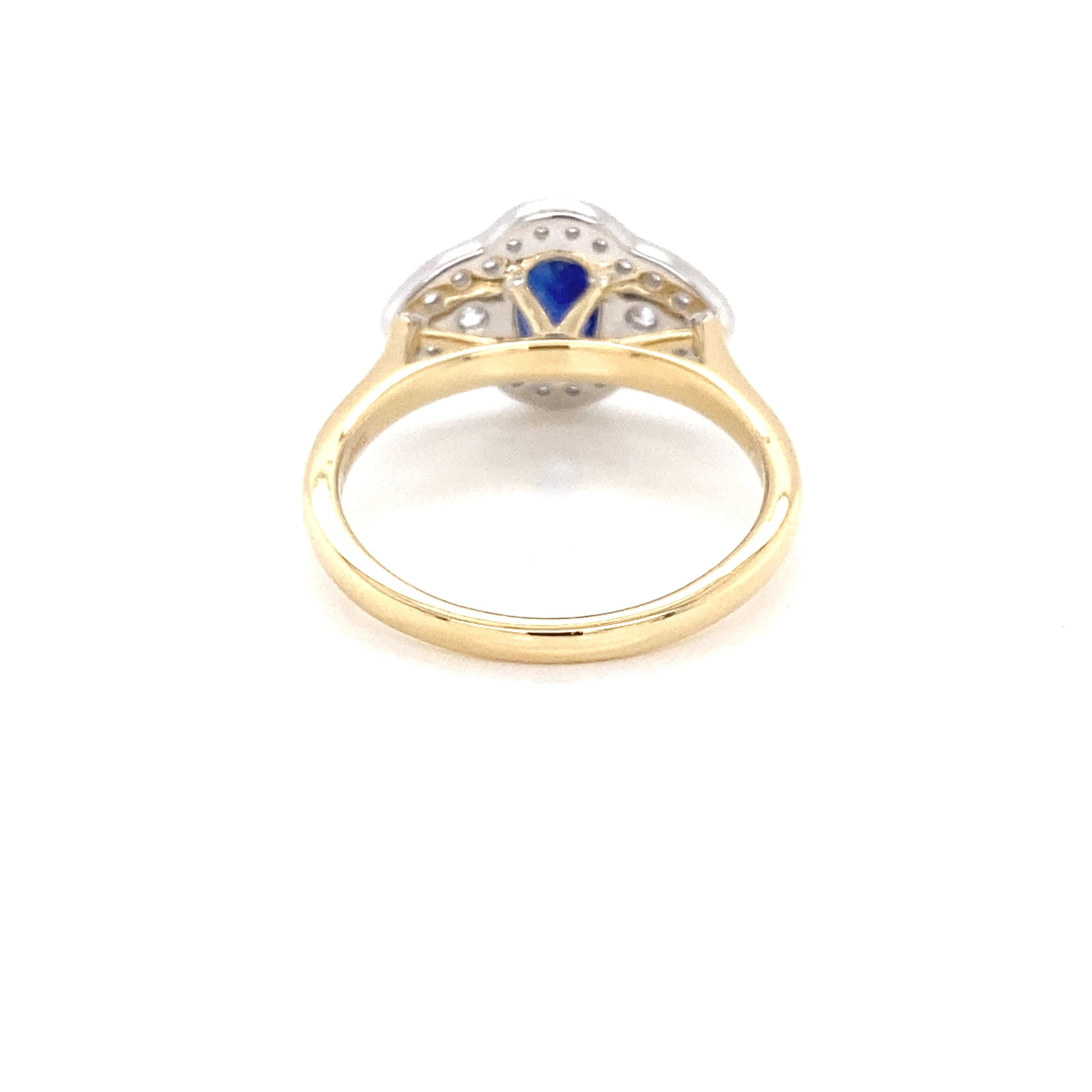 Oval Sapphire and round brilliant cut diamond fancy halo style ring Gardiner Brothers