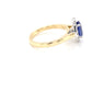 Tanzanite and round brilliant cut diamond halo ring Gardiner Brothers