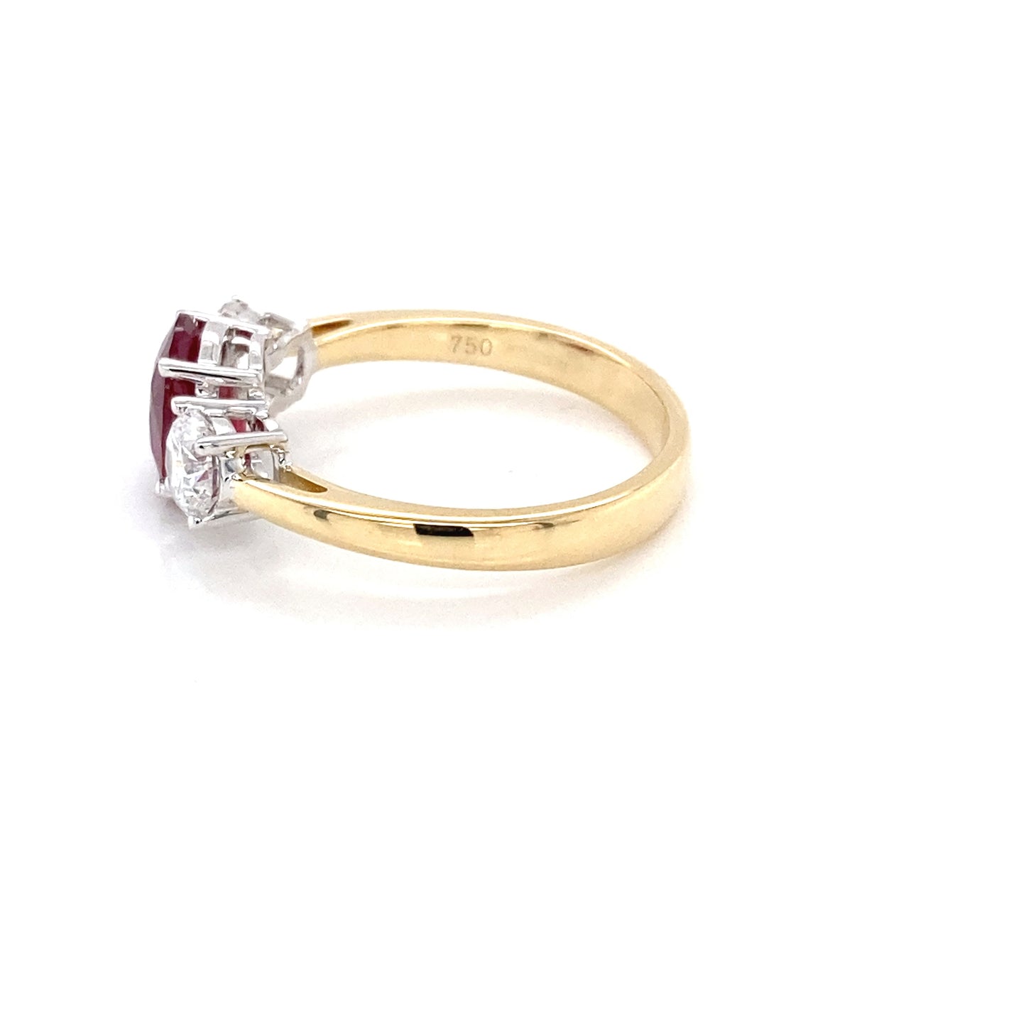 Oval Shaped Ruby and round brilliant cut diamond 3 stone ring Gardiner Brothers