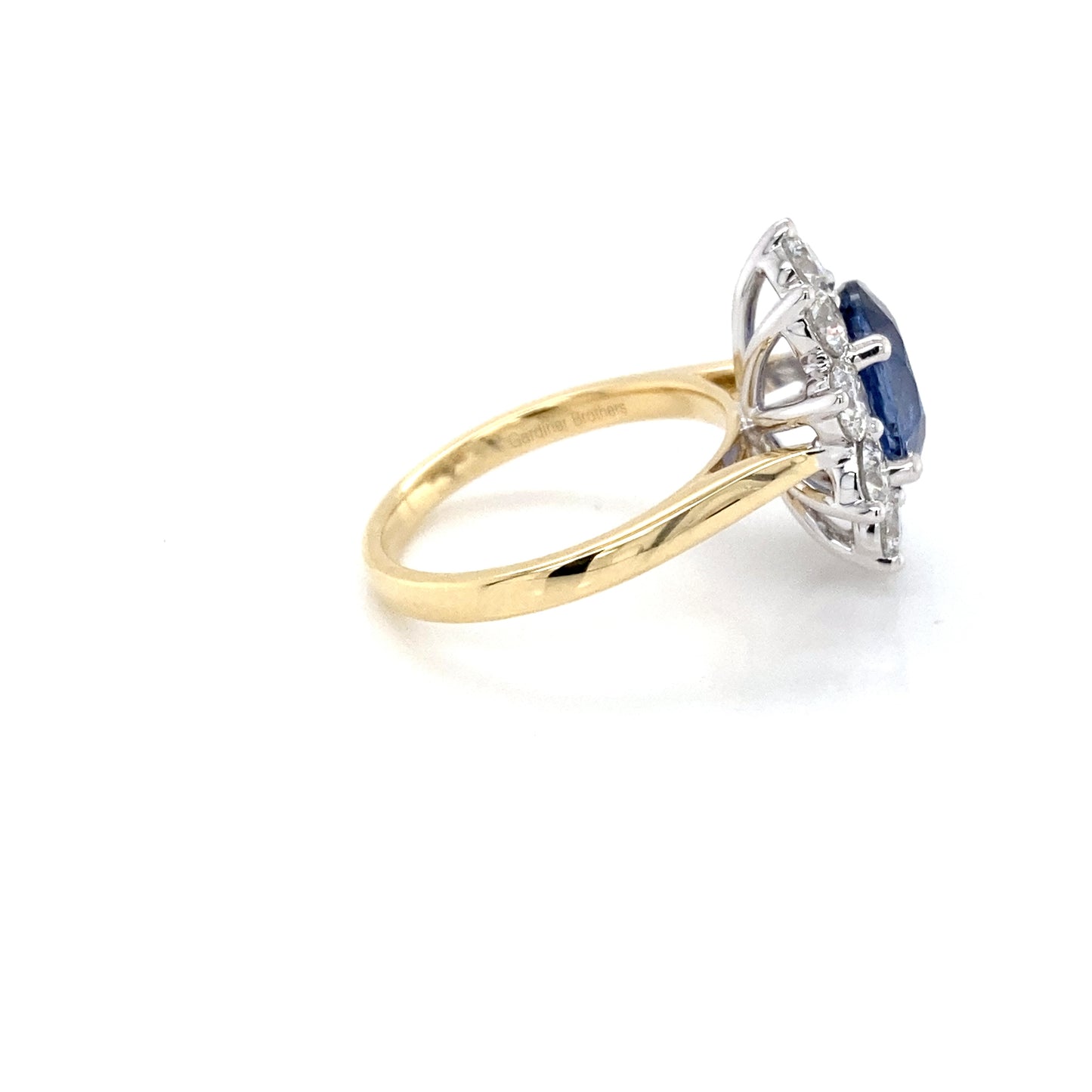 Oval Sapphire and Round Brilliant cut diamond cluster style ring Gardiner Brothers