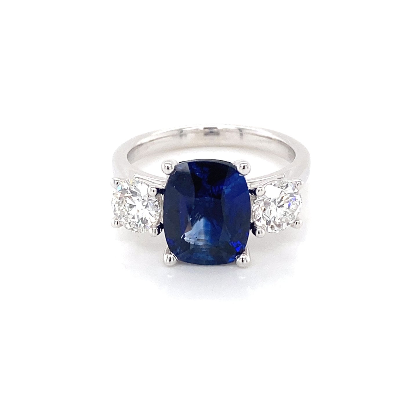 Cushion Shaped Sapphire and round brilliant cut diamond 3 stone ring Gardiner Brothers