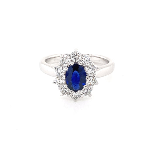 Oval shaped sapphire and round brilliant cut diamond cluster ring Gardiner Brothers