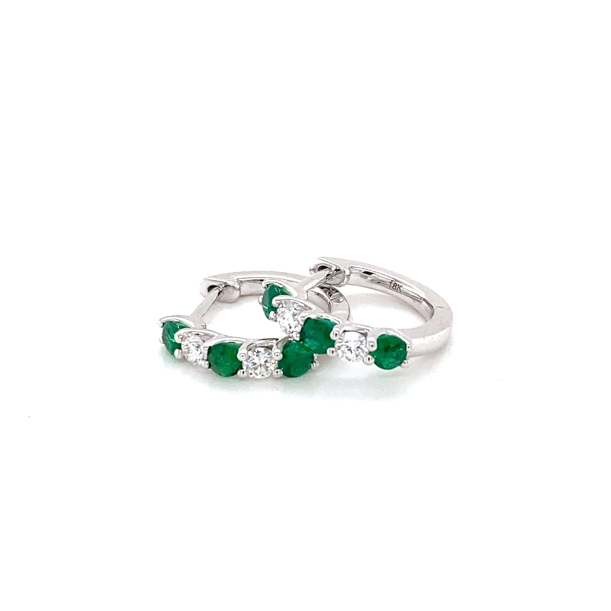 Round emerald and round brilliant cut diamond hoop style earrings Gardiner Brothers