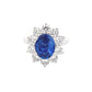 Oval Shaped Sapphire and round brilliant cut diamond traditional cluster ring Gardiner Brothers