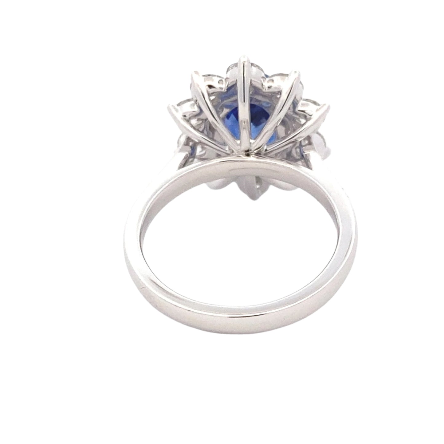 Oval Shaped Sapphire and round brilliant cut diamond traditional cluster ring Gardiner Brothers