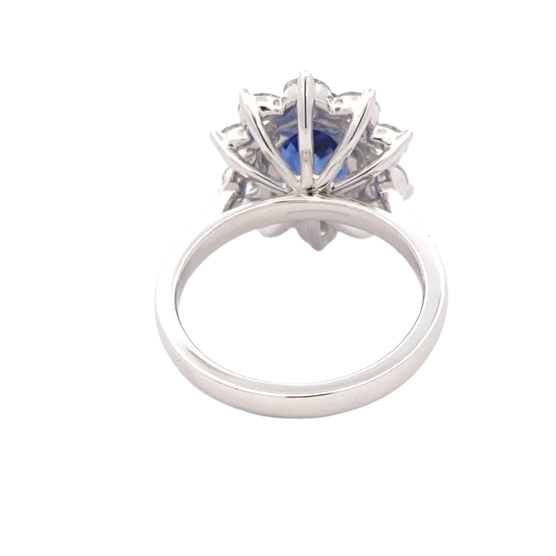 Oval Shaped Sapphire and round brilliant cut diamond traditional cluster ring Gardiner Brothers