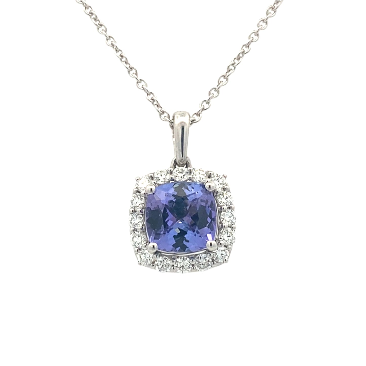 Cushion shaped Tanzanite and round brilliant cut diamond halo pendant Gardiner Brothers