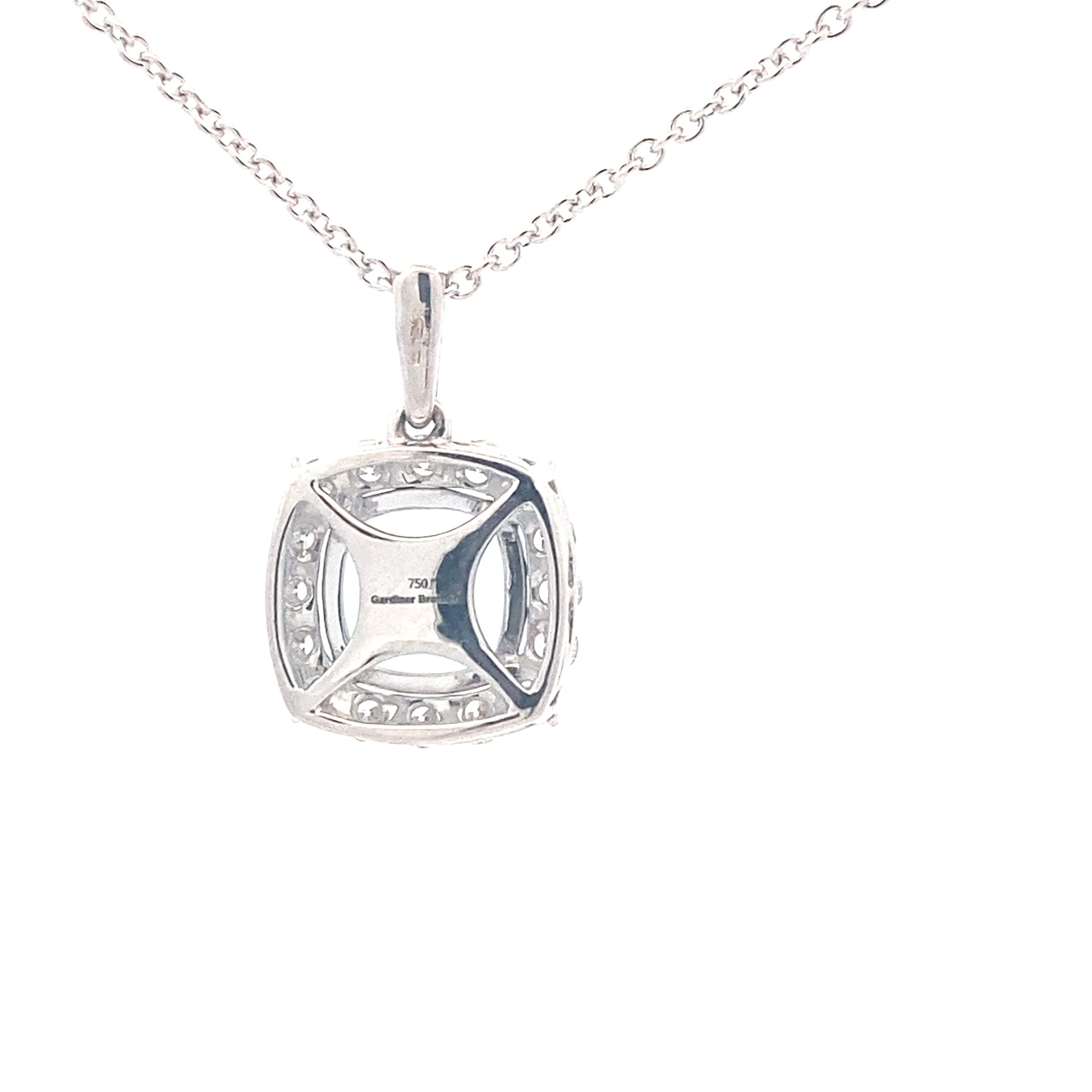 Cushion shaped Aquamarine and round brilliant cut diamond halo pendant Gardiner Brothers