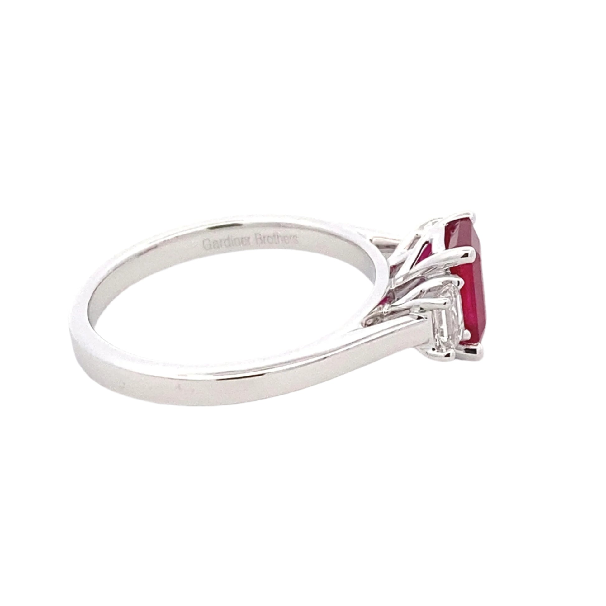 Octagonal shaped Ruby and emerald cut diamond 3 stone ring Gardiner Brothers