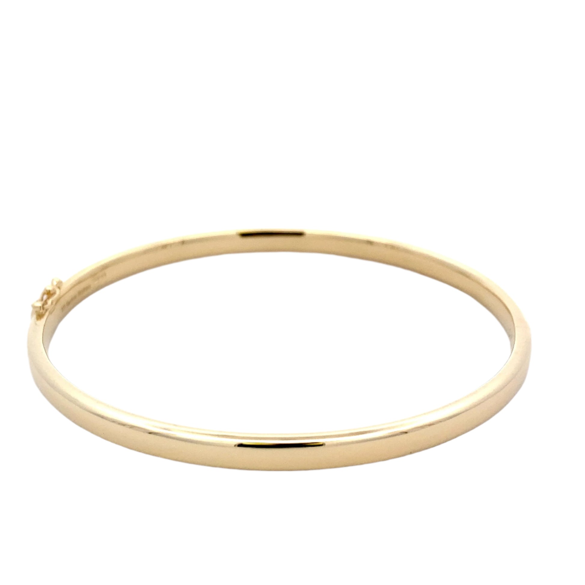 Yellow Gold 4mm solid bangle with a Court profile Gardiner Brothers