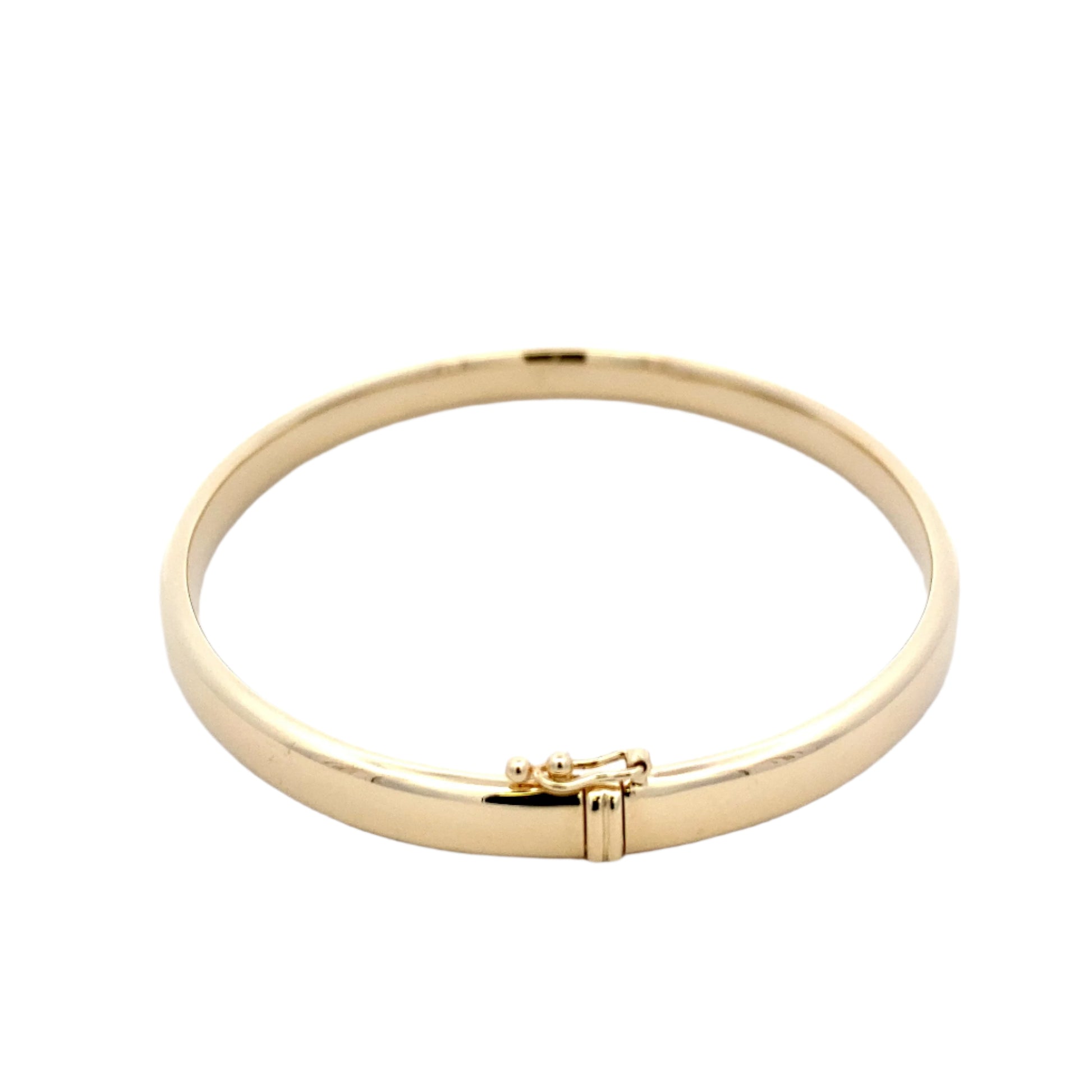 Yellow gold 6mm solid bangle with a court profile Gardiner Brothers