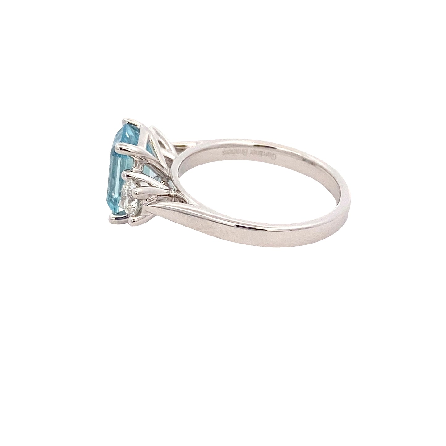 Octagonal Aquamarine and round brilliant cut diamond 3 stone ring Gardiner Brothers