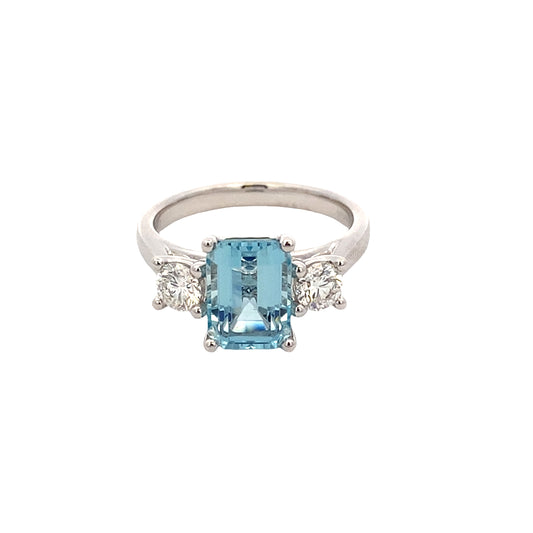Octagonal Aquamarine and round brilliant cut diamond 3 stone ring Gardiner Brothers