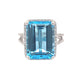 Octagonal Swiss Blue Topaz and Round Brilliant Cut Diamond Halo Ring with Split Diamond Set Shoulders Gardiner Brothers