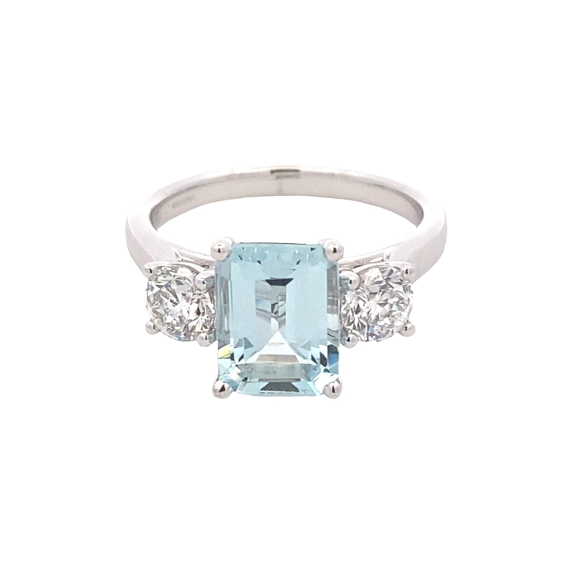 Octagonal shaped aquamarine and round brilliant cut diamond 3 stone ring Gardiner Brothers