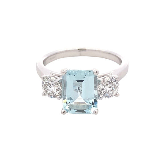 Octagonal shaped aquamarine and round brilliant cut diamond 3 stone ring Gardiner Brothers