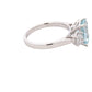 Octagonal shaped aquamarine and round brilliant cut diamond 3 stone ring Gardiner Brothers
