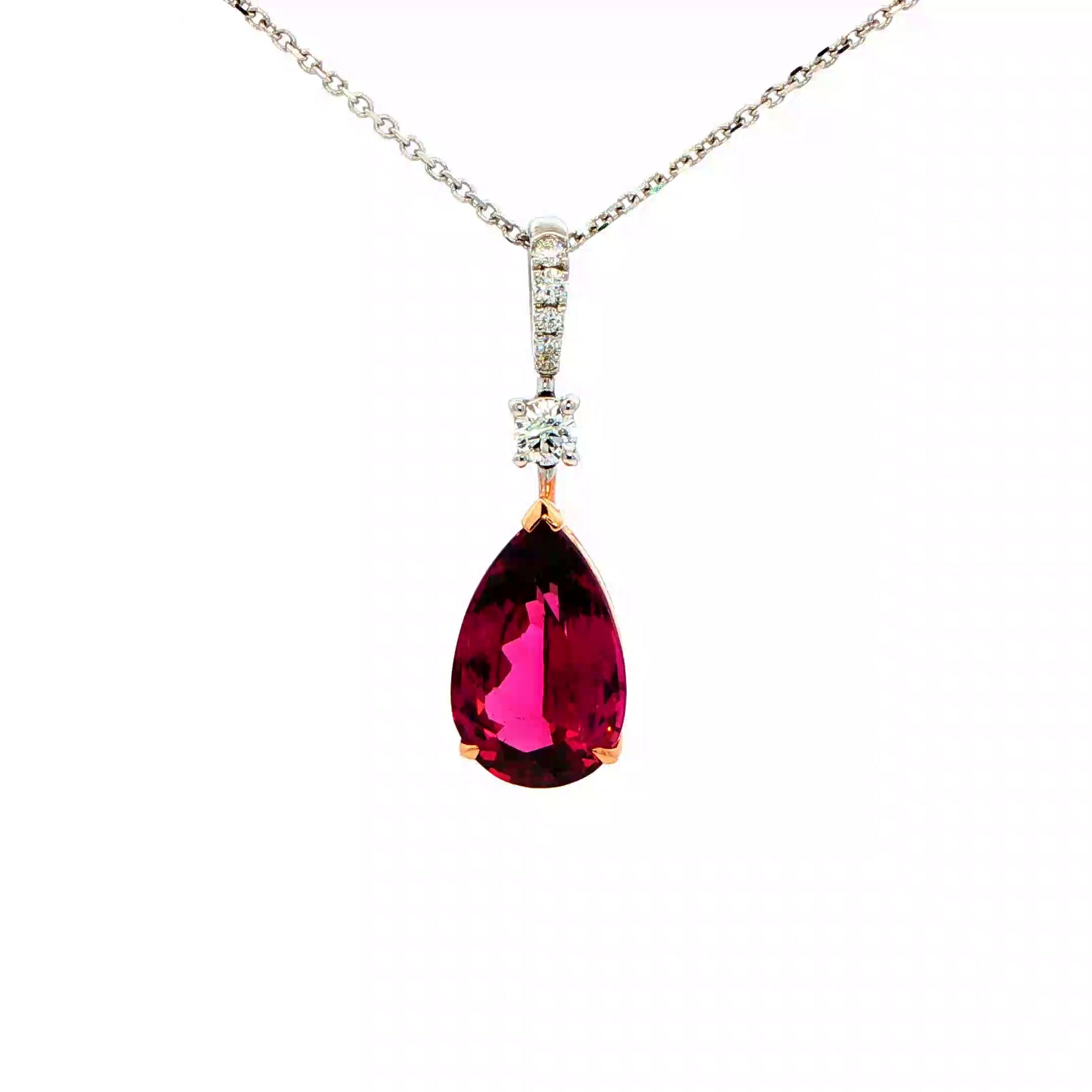 Pear Shaped Purple Garnet and Round Brilliant Cut Drop Style Pendant Gardiner Brothers