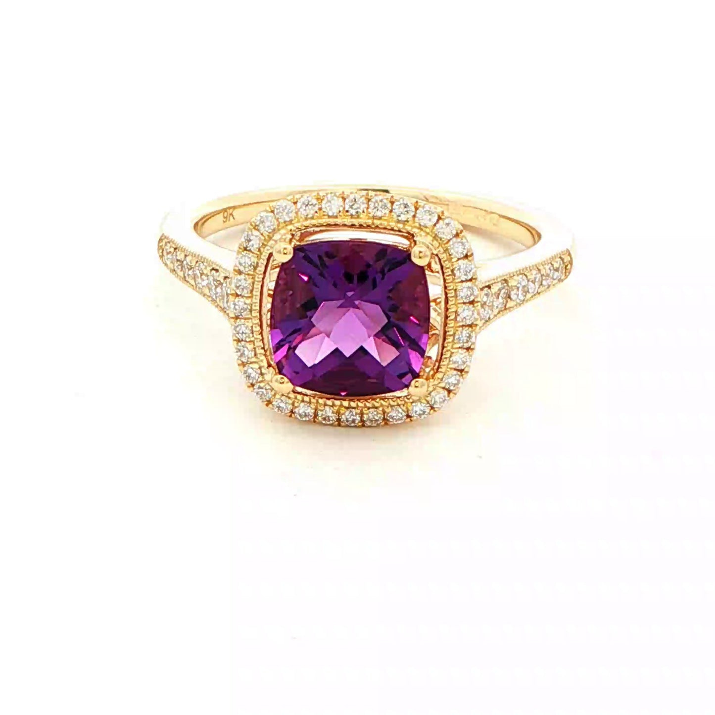 Cushion shaped amethyst and round brilliant cut diamond halo cluster ring Gardiner Brothers