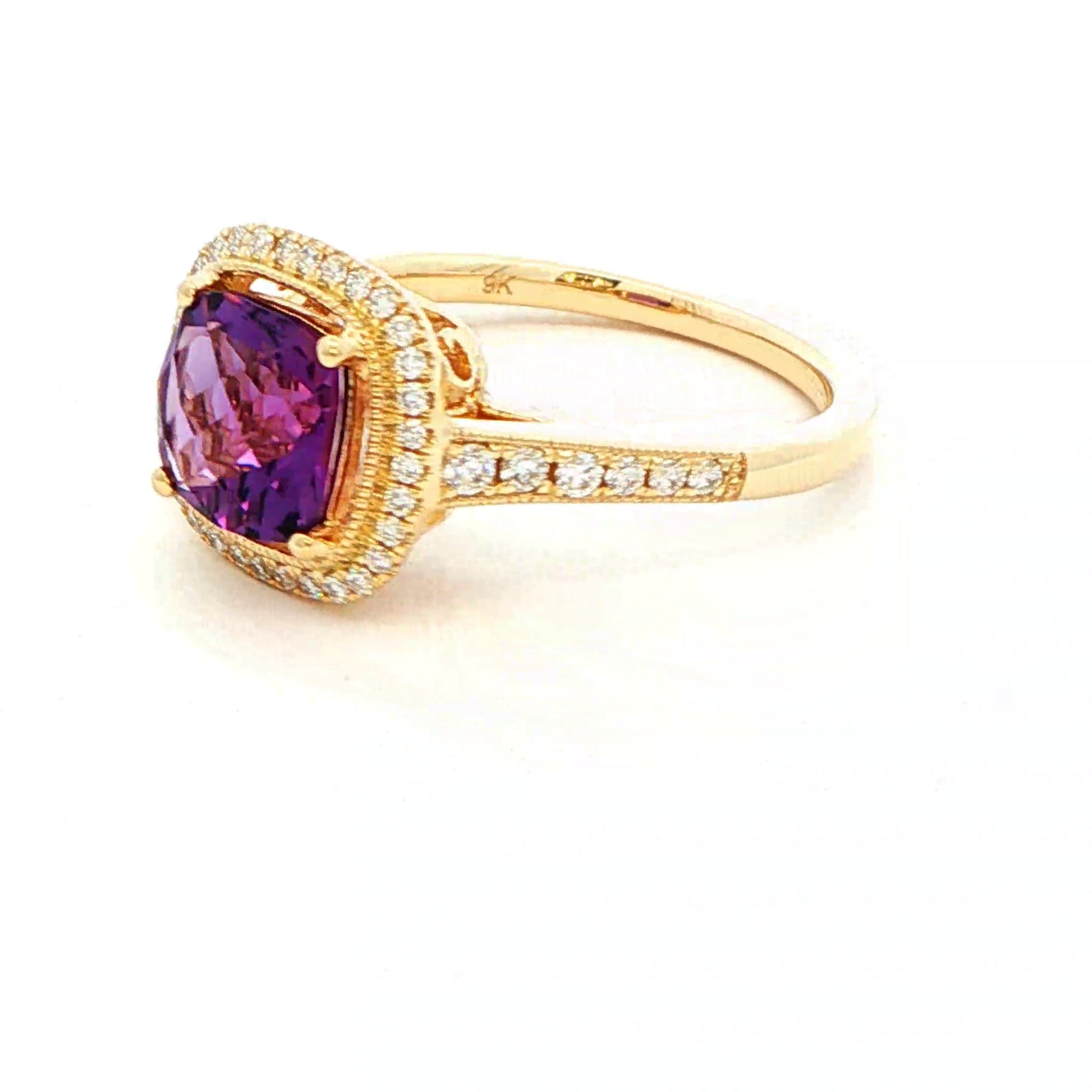 Cushion shaped amethyst and round brilliant cut diamond halo cluster ring Gardiner Brothers
