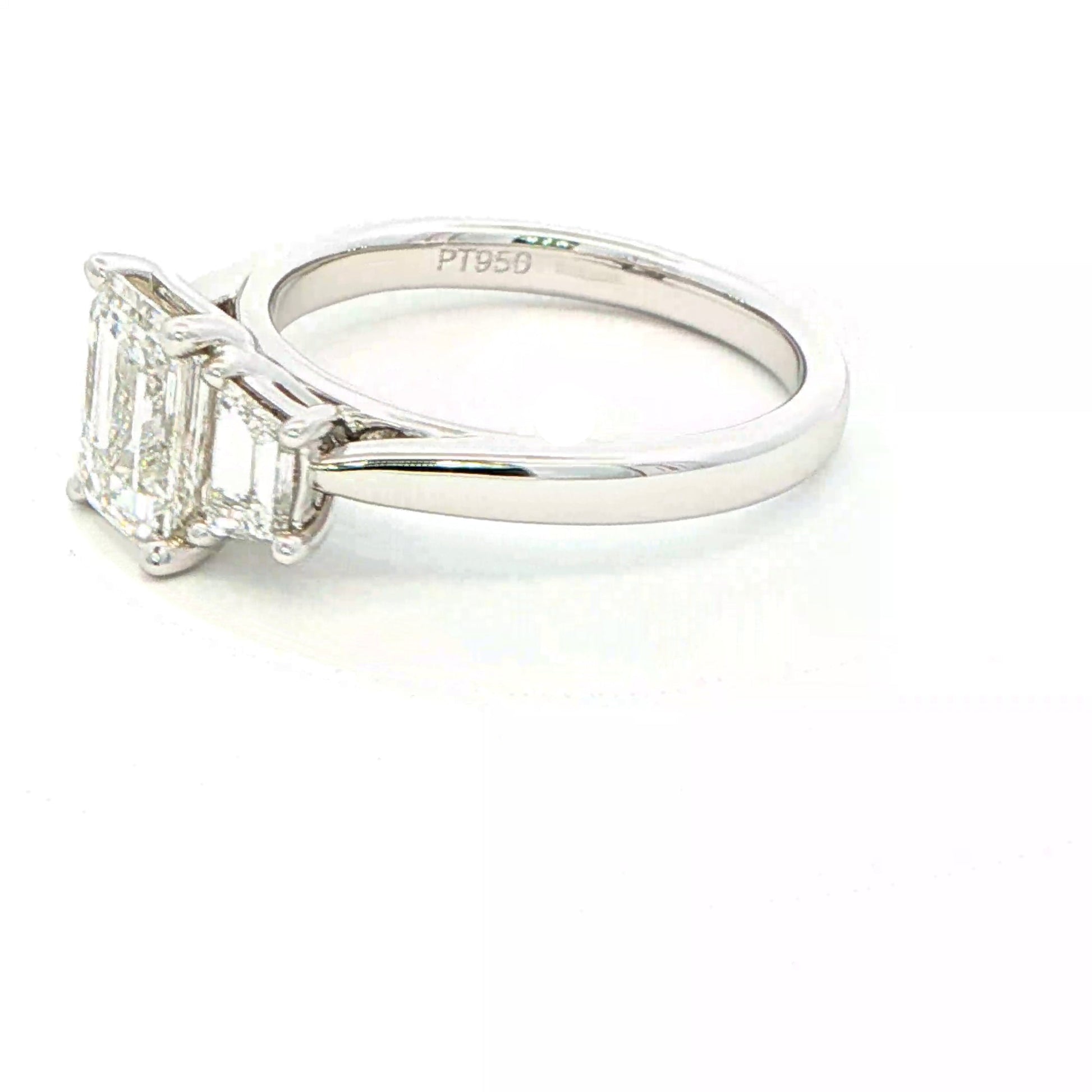 Emerald and Trapezoid cut diamond 3 stone ring - 2.00cts Gardiner Brothers