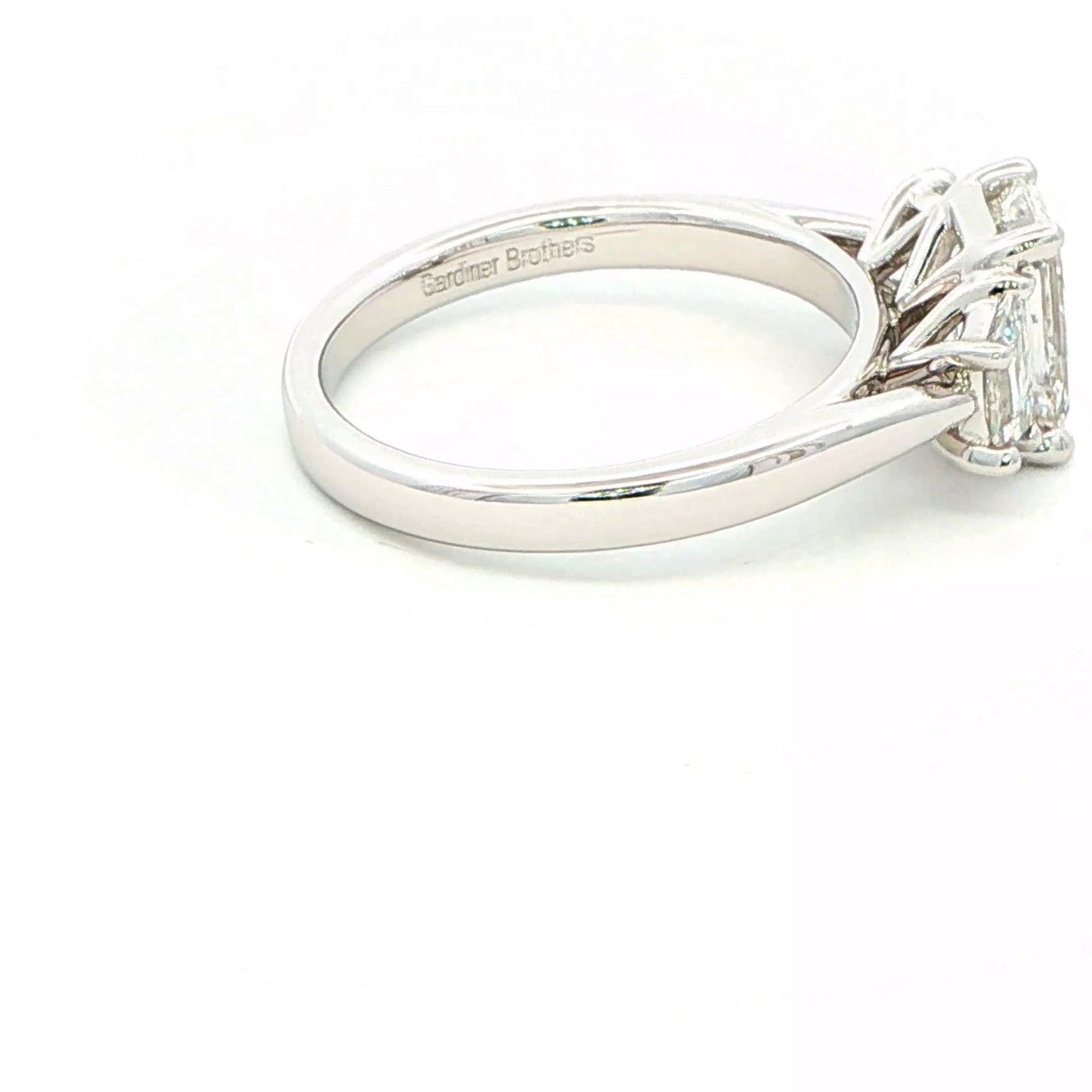 Emerald and Trapezoid cut diamond 3 stone ring - 2.00cts Gardiner Brothers