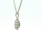 Oval Shaped emerald and round brilliant cut diamond cluster pendant Gardiner Brothers