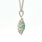 Oval shaped emerald and round brilliant cut diamond cluster pendant Gardiner Brothers
