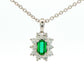 Octagonal shaped emerald and round brilliant cut diamond cluster pendant Gardiner Brothers