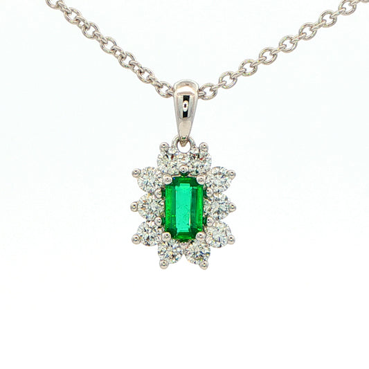 Octagonal shaped emerald and round brilliant cut diamond cluster pendant Gardiner Brothers