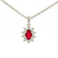 Oval shaped ruby and round brilliant cut diamond cluster style pendant Gardiner Brothers