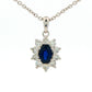 Oval shaped sapphire and round brilliant cut diamond cluster style pendant Gardiner Brothers