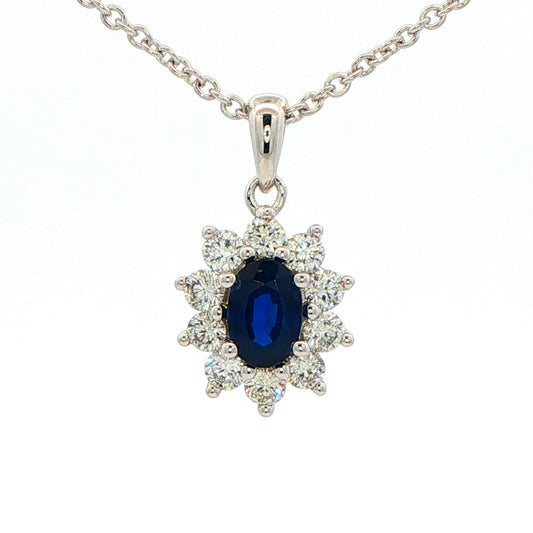Oval shaped sapphire and round brilliant cut diamond cluster style pendant Gardiner Brothers