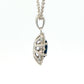 Oval shaped sapphire and round brilliant cut diamond cluster style pendant Gardiner Brothers