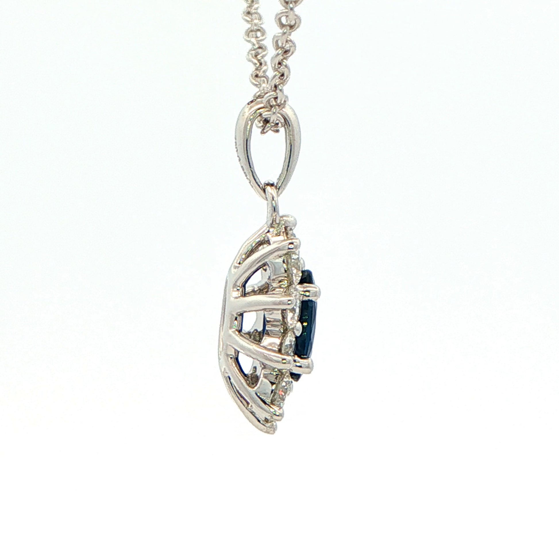 Oval shaped sapphire and round brilliant cut diamond cluster style pendant Gardiner Brothers