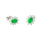 Oval shaped emerald and round brilliant cut diamond cluster style earrings Gardiner Brothers