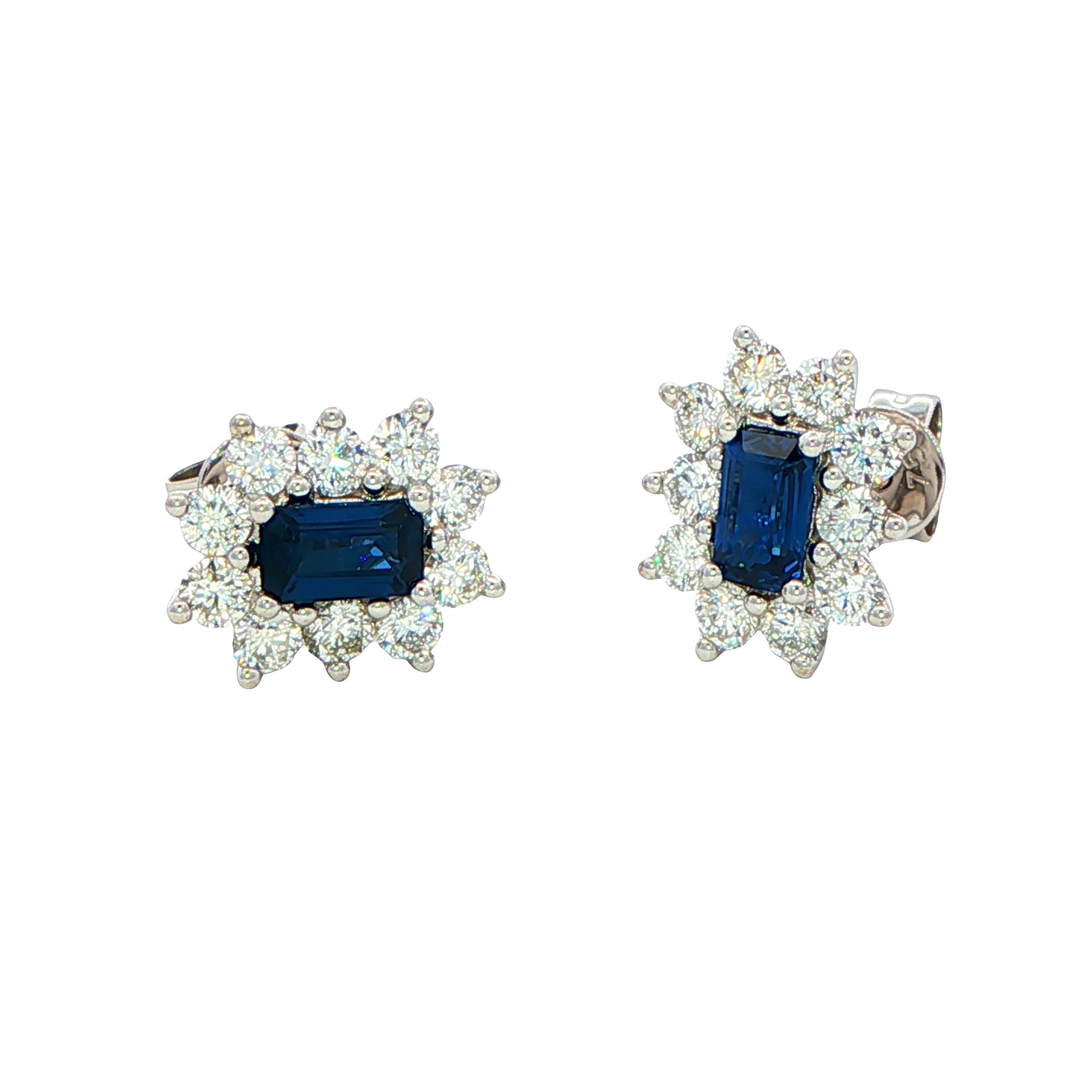 Octagonal shaped sapphire and round brilliant cut diamond cluster style earrings. Gardiner Brothers