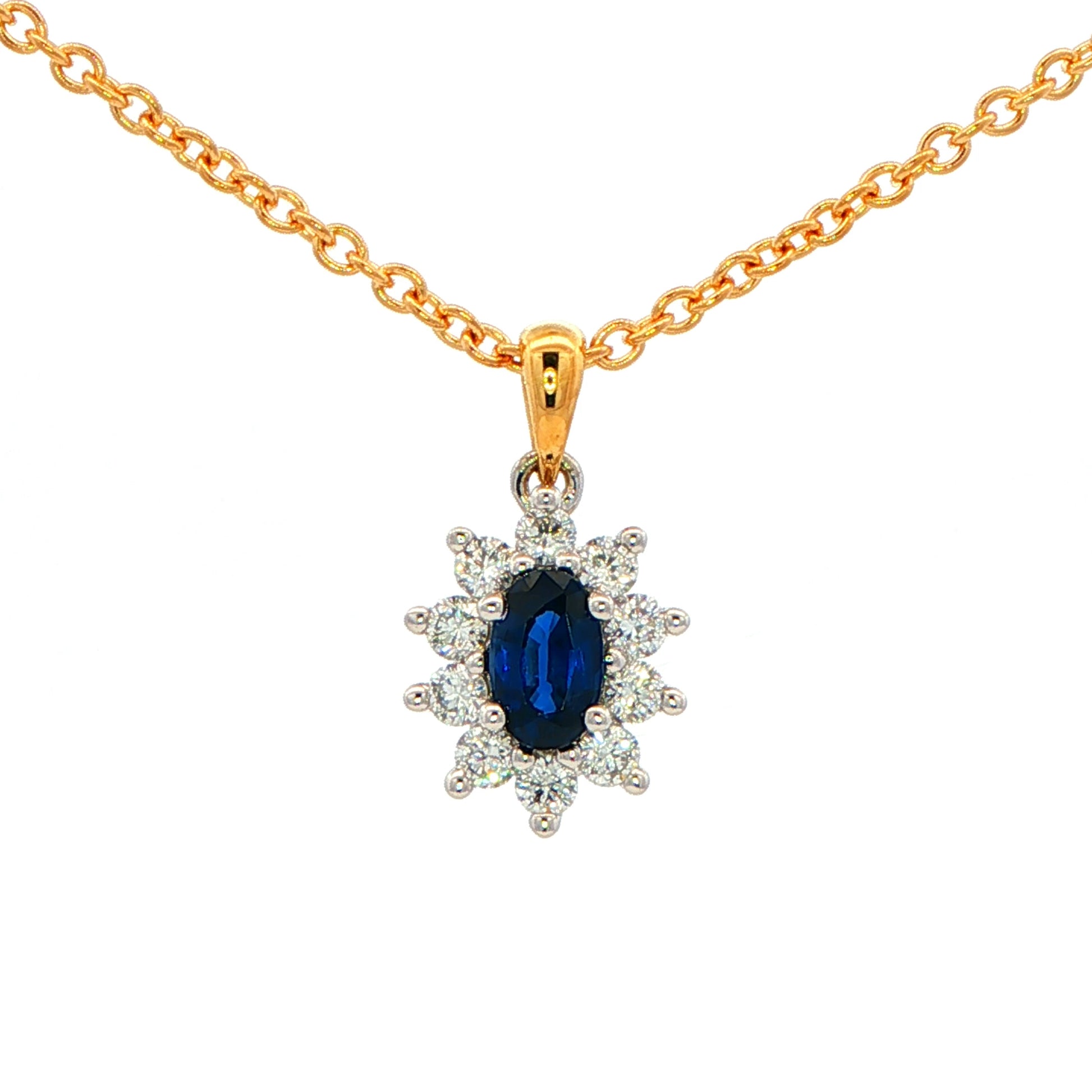 Oval shaped sapphire and round brilliant cut diamond cluster style pendant Gardiner Brothers