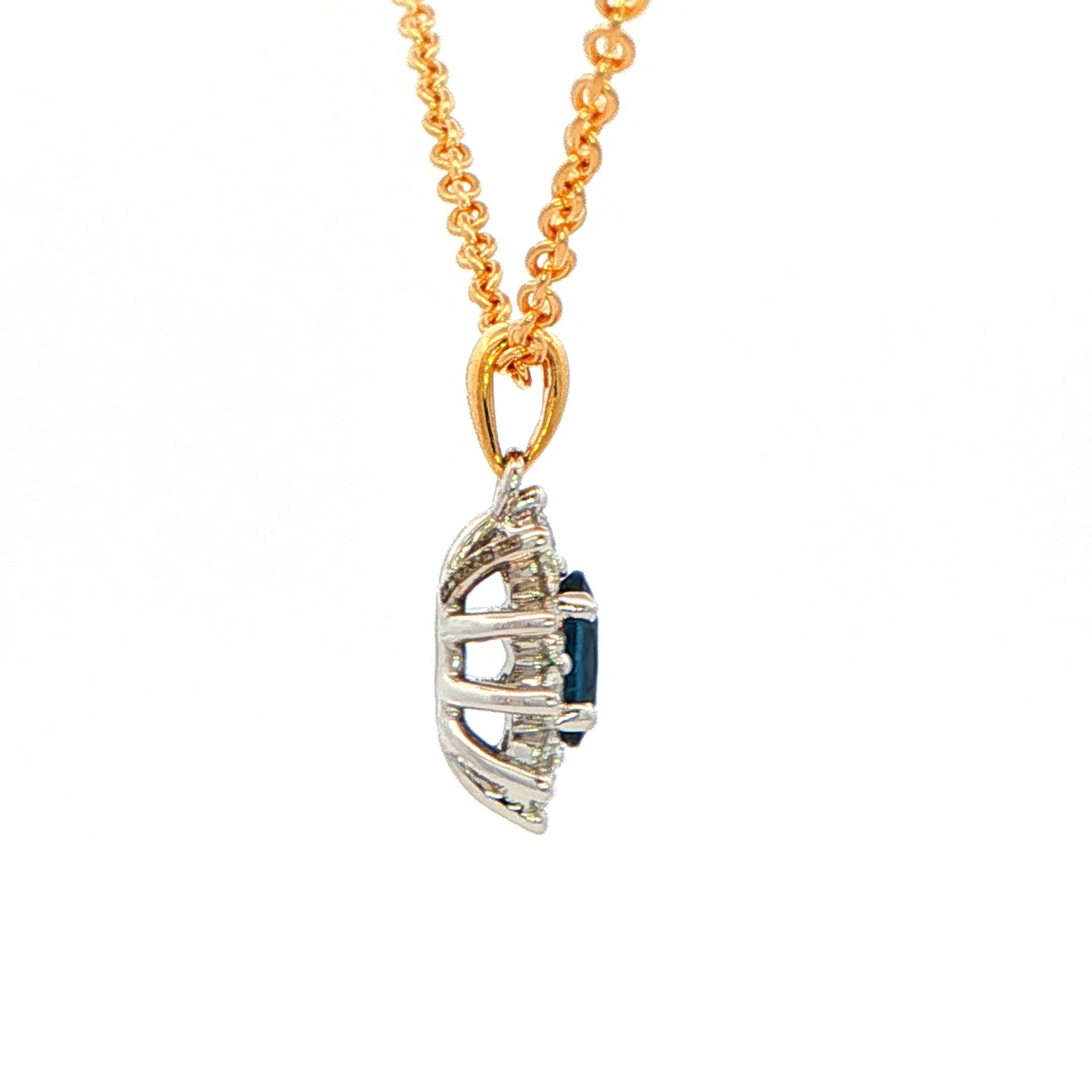 Oval shaped sapphire and round brilliant cut diamond cluster style pendant Gardiner Brothers
