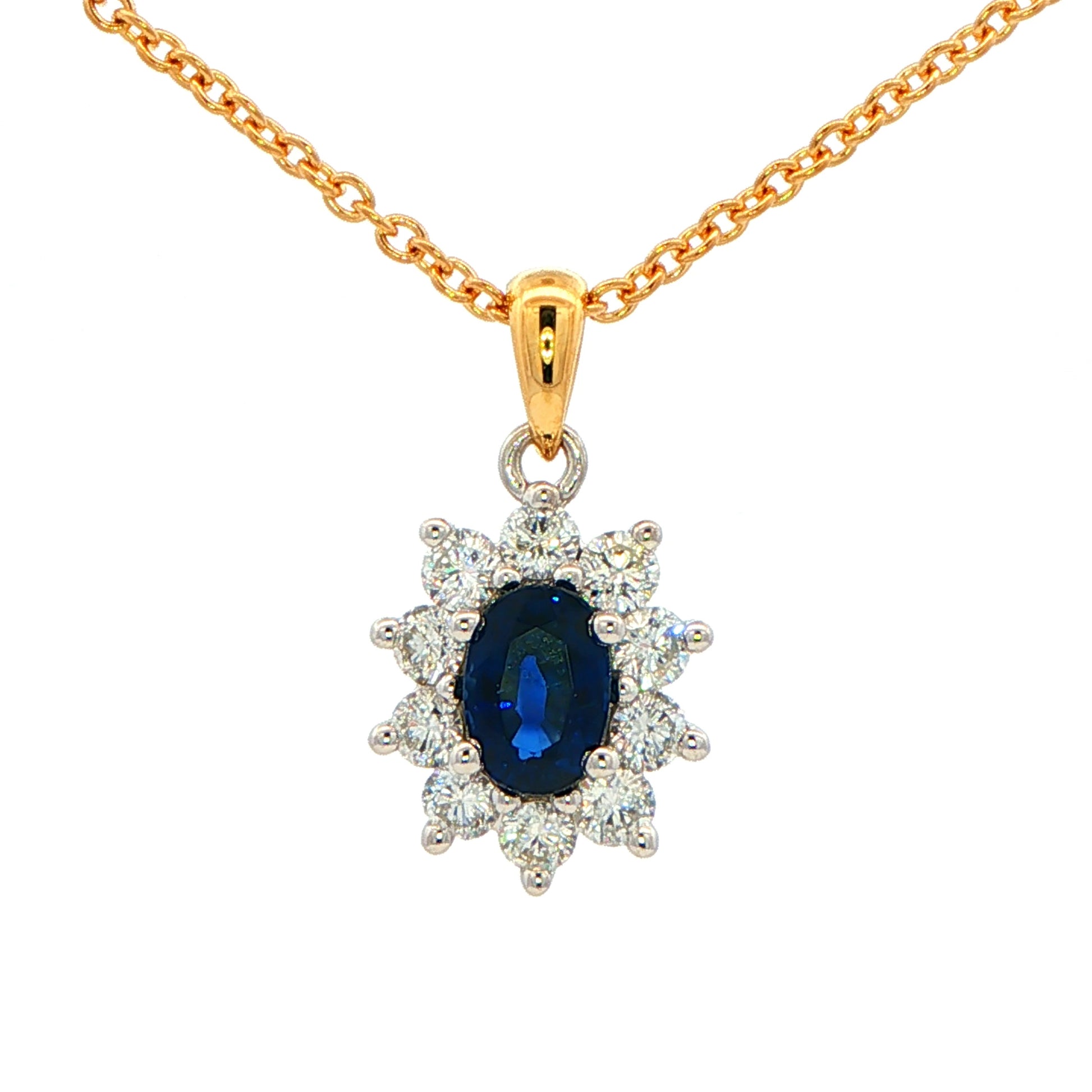 Oval shaped Sapphire and round brilliant cut diamond cluster style pendant Gardiner Brothers