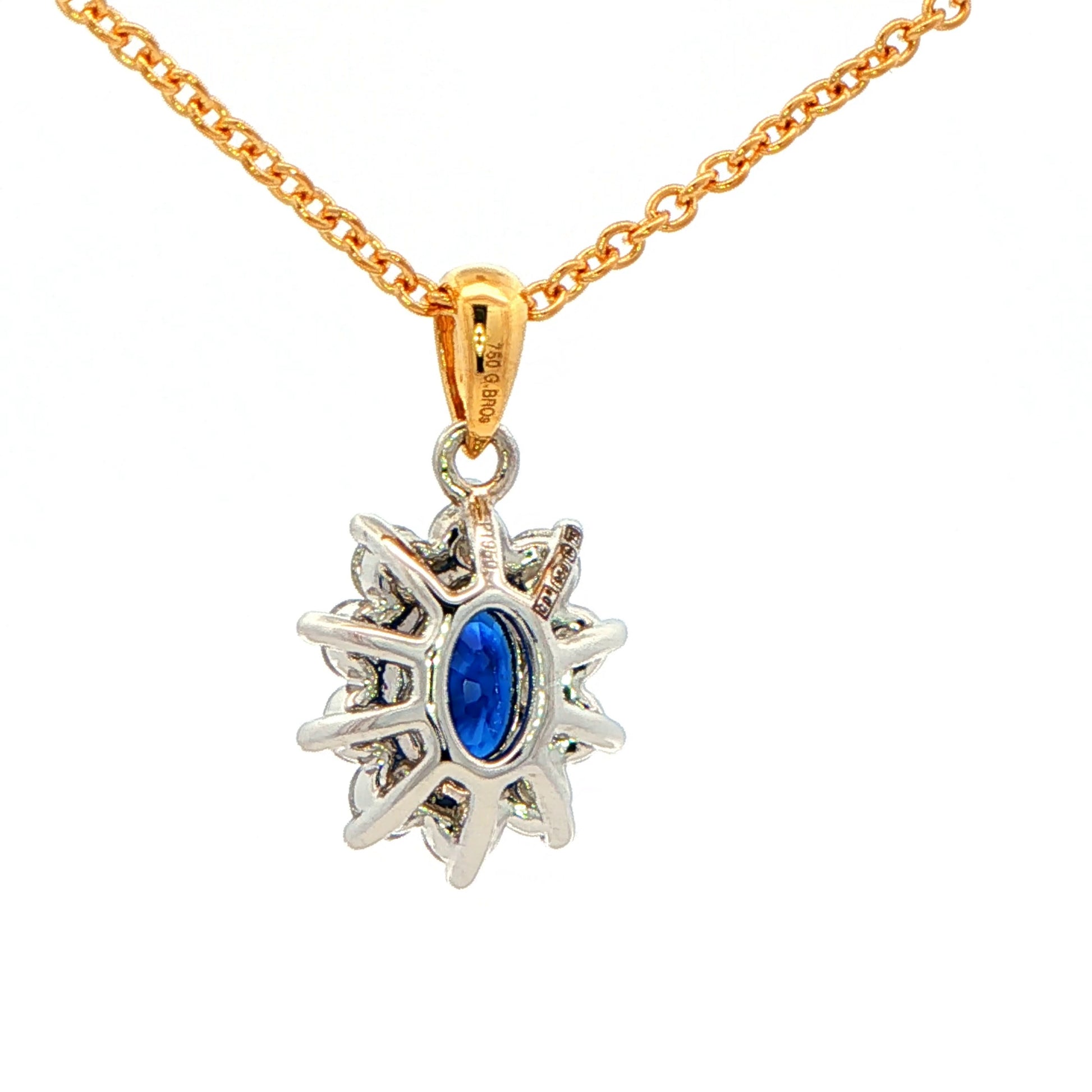 Oval shaped Sapphire and round brilliant cut diamond cluster style pendant Gardiner Brothers