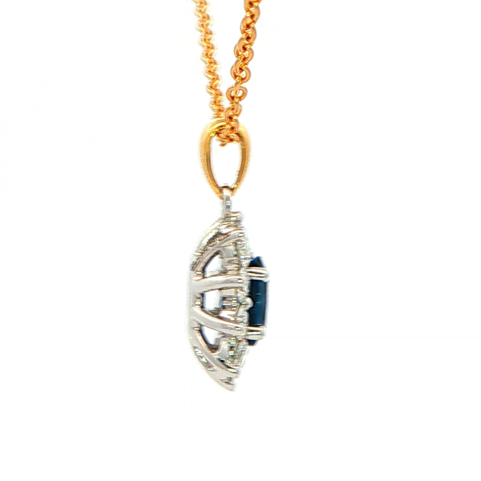 Oval shaped Sapphire and round brilliant cut diamond cluster style pendant Gardiner Brothers