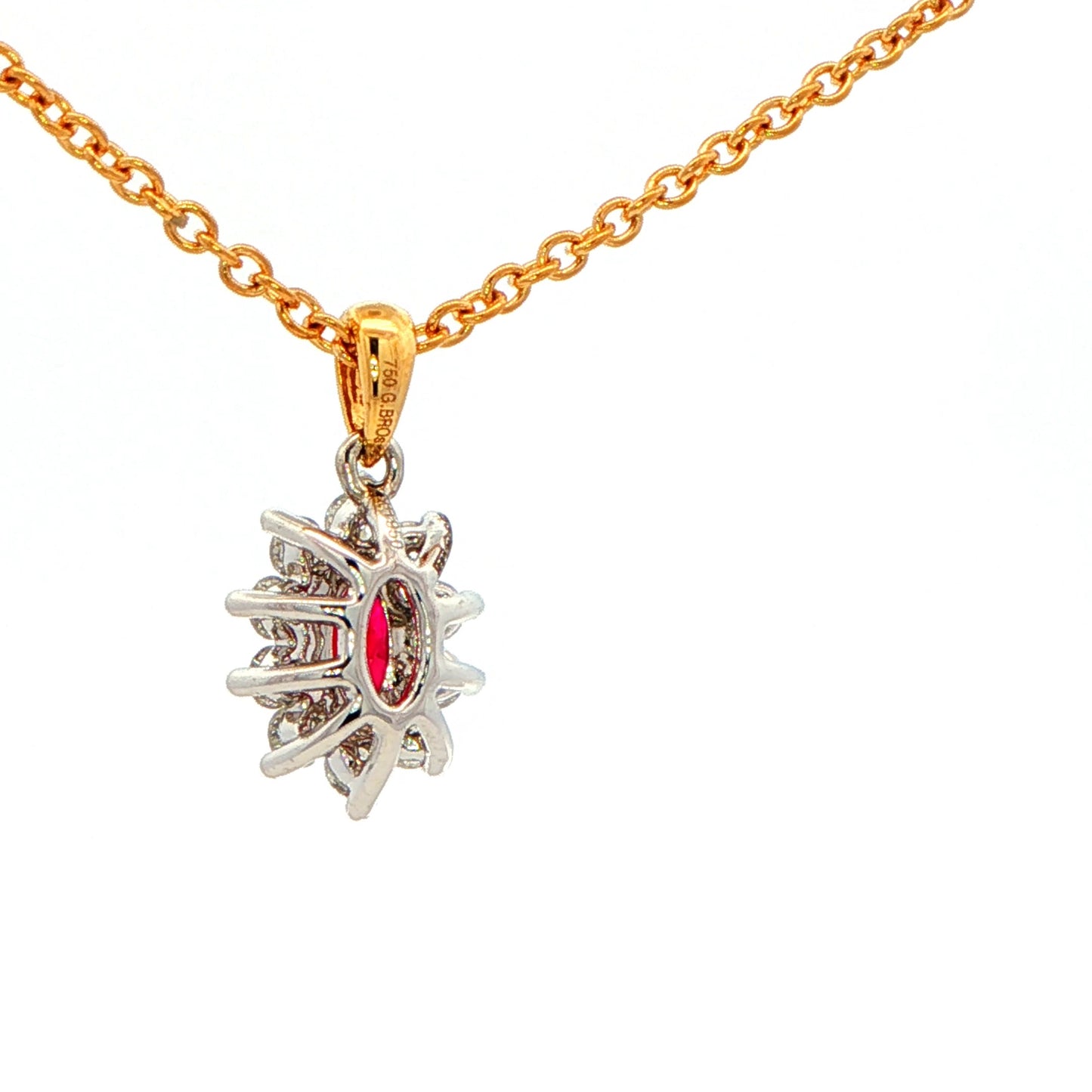 Oval shaped ruby and round brilliant cut diamond cluster style pendant Gardiner Brothers
