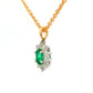 Oval shaped emerald and round brilliant cut diamond cluster style pendant Gardiner Brothers