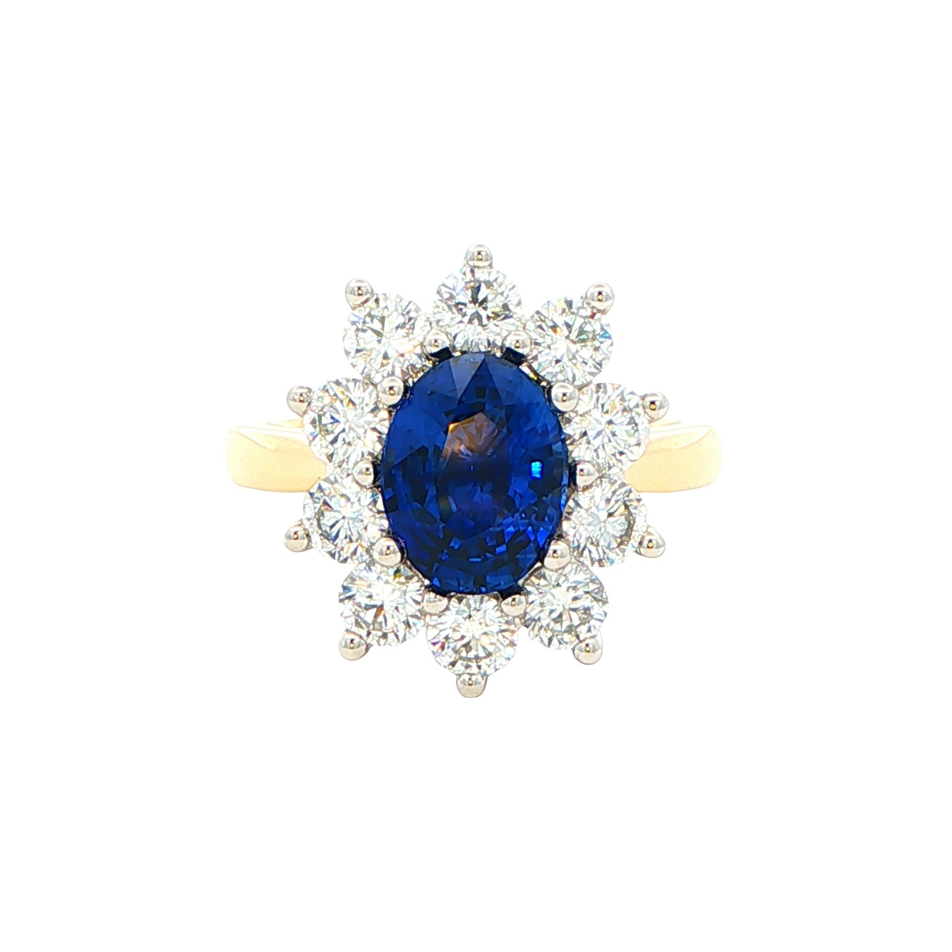 Oval Sapphire and round brilliant cut diamond cluster ring Gardiner Brothers