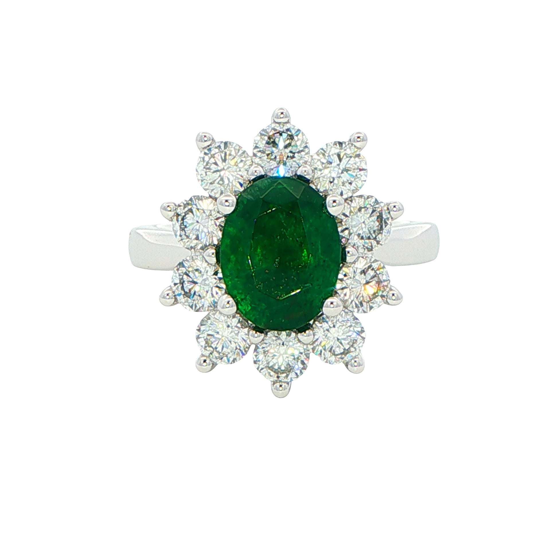 Oval shaped emerald and round brilliant cut diamond cluster style ring Gardiner Brothers