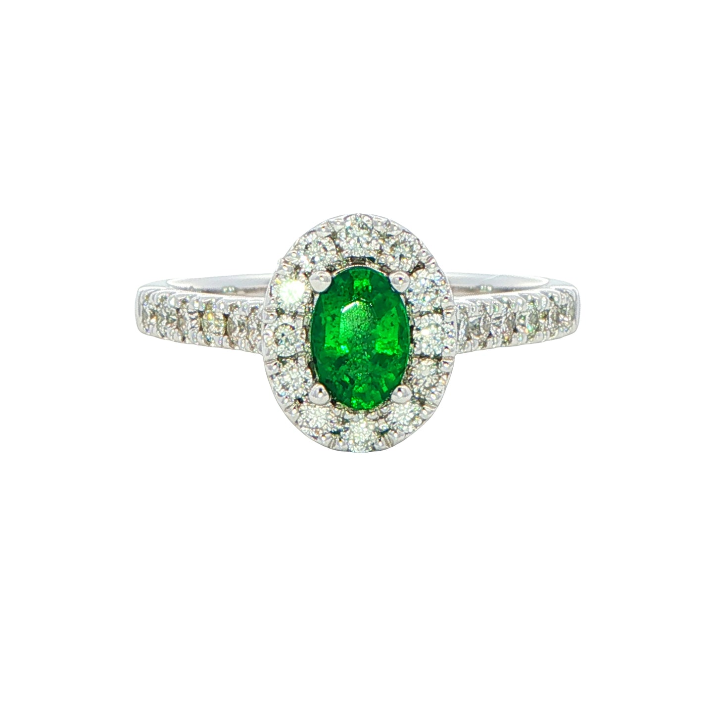 Emerald and round Brilliant Cut diamond halo style ring Gardiner Brothers
