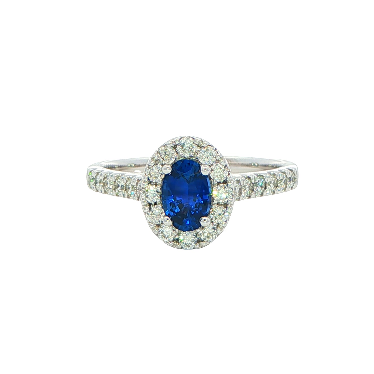 Oval shaped sapphire and round brilliant cut diamond halo style ring Gardiner Brothers