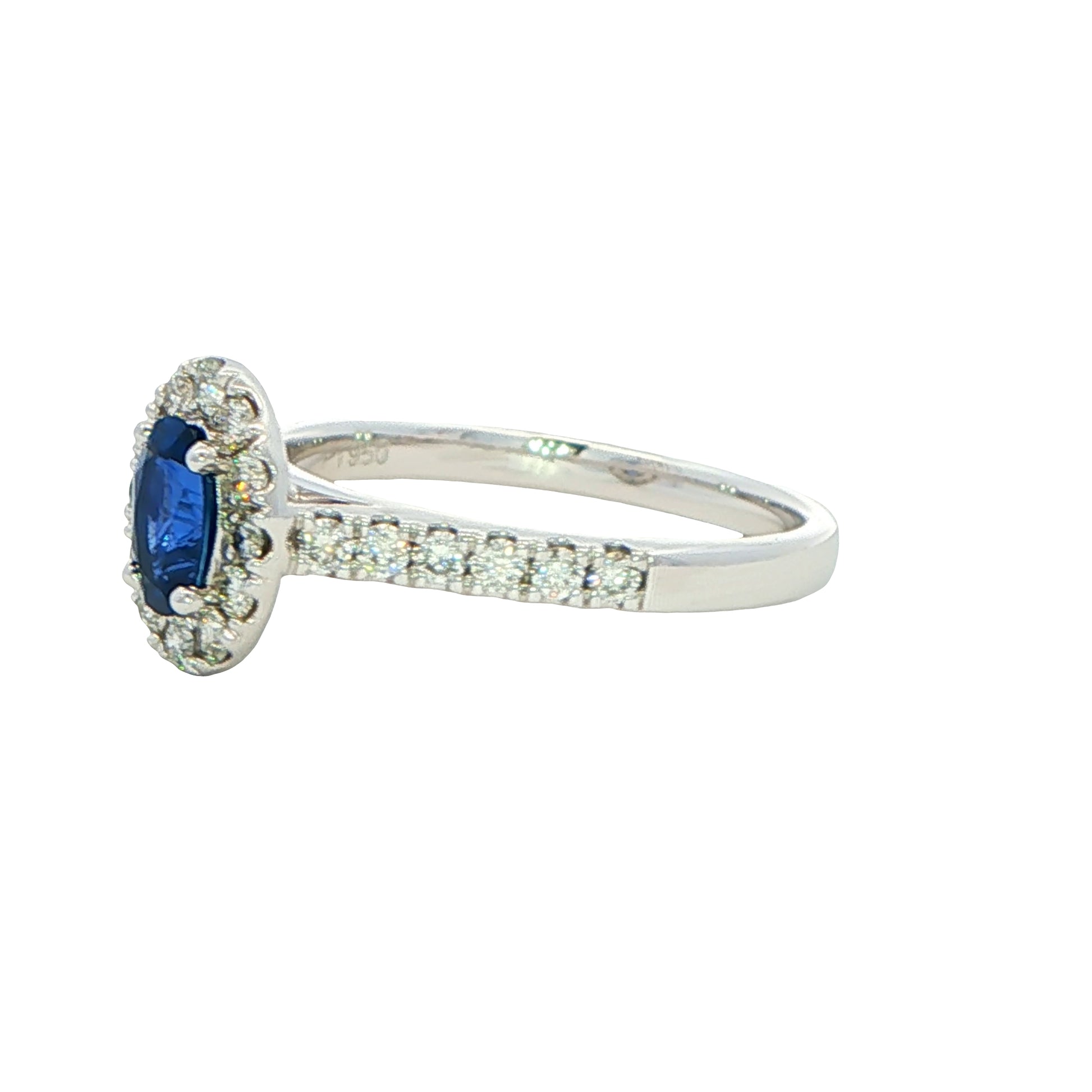 Oval shaped sapphire and round brilliant cut diamond halo style ring Gardiner Brothers